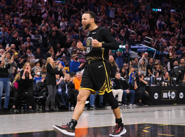 Golden State Warriors guard Stephen Curry celebrates after a play.